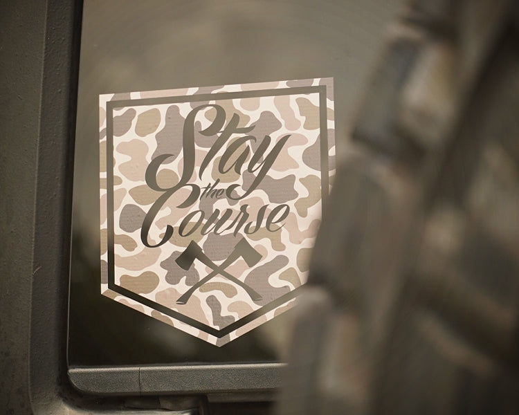 Camouflage-style 'Stay the Course' decal on a vehicle window