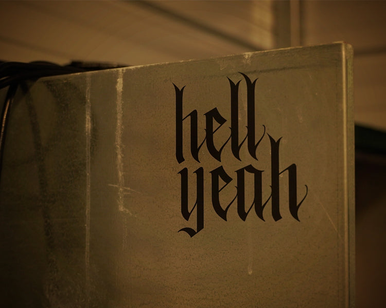 Flat black vinyl decal that reads hell yeah