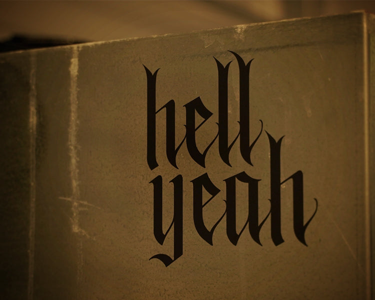 Flat black vinyl decal that reads hell yeah