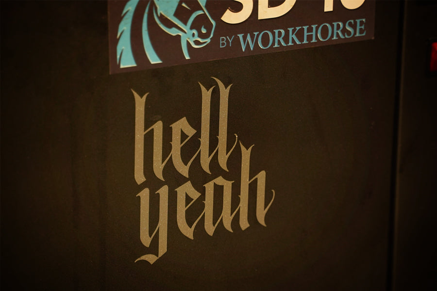 silver sparkle vinyl decal that reads hell yeah