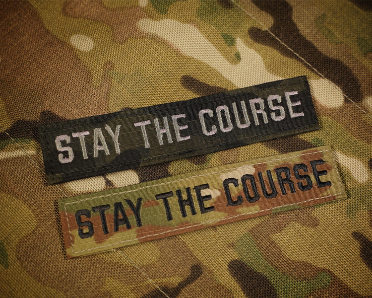 Two 'Stay the Course' patches on a camouflage background