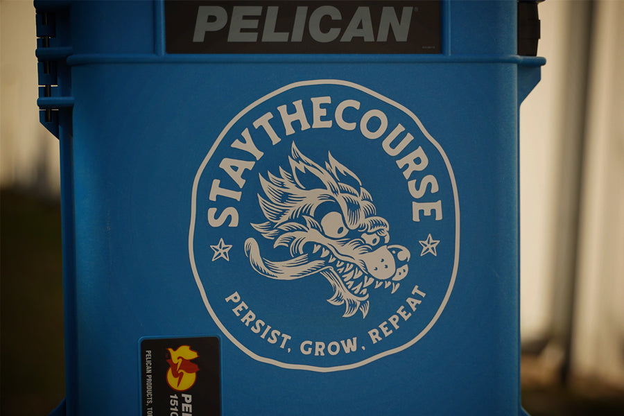 Blue Pelican cooler with 'Stay The Course' logo and motivational quote.