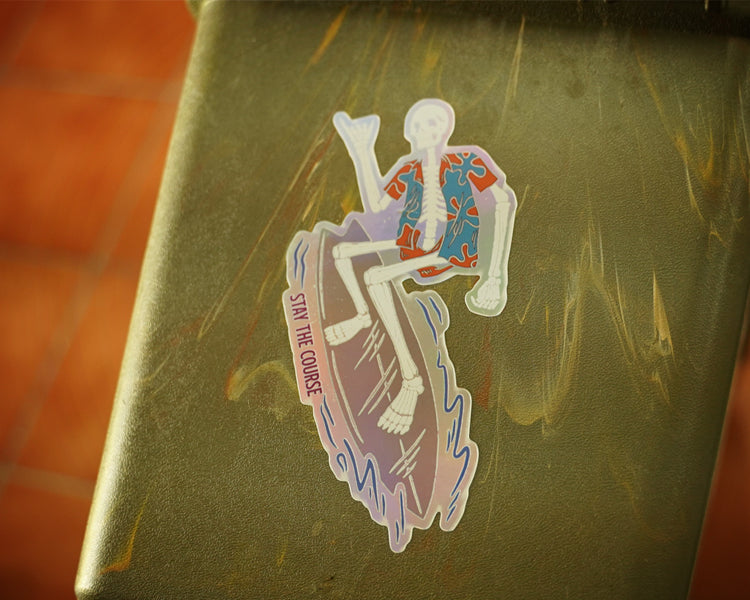 Sticker with a design of a skeleton on a surfboard on a green surface