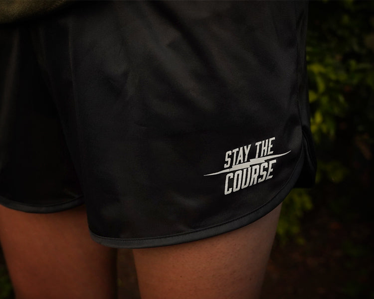 Black shorts with 'Stay the Course' text on a dark background