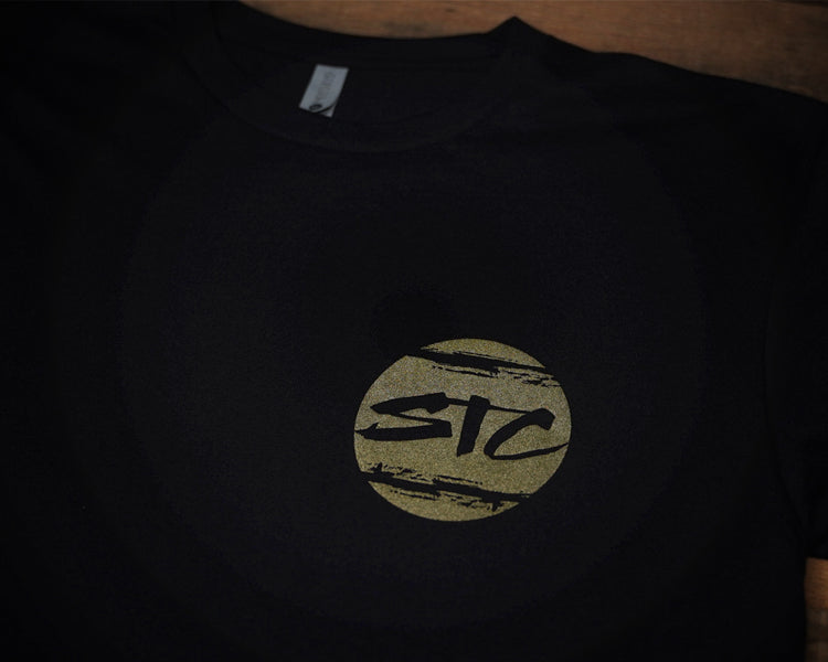 Black T-shirt with white and gold print