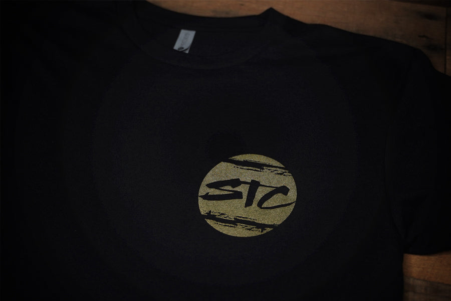 Black T-shirt with white and gold print