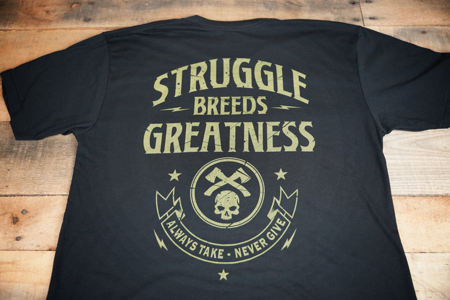 Black t-shirt with 'STRUGGLE BREEDS GREATNESS' text and green graphics, featuring axes and a skull, on the front and back.