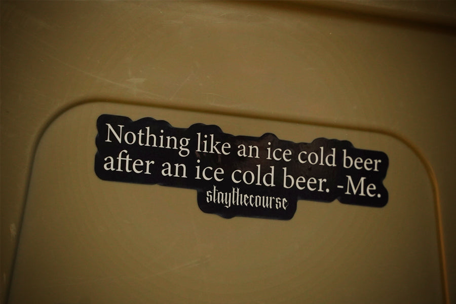 Sticker with humorous text on a beige surface