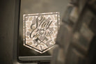 Camouflage-style 'Stay the Course' decal on a vehicle window