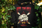 Black hoodie with graphic design and text 'Give 'em Hell' in a natural setting