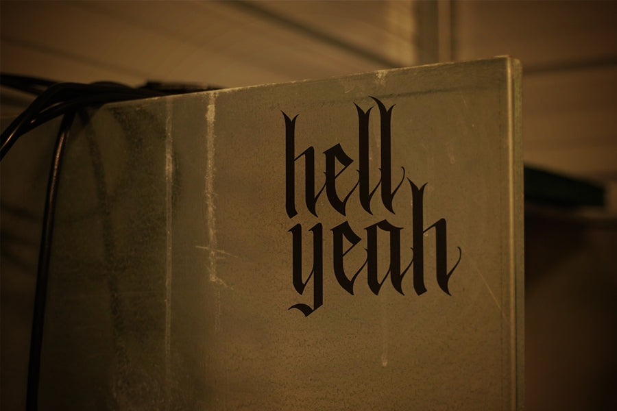 Flat black vinyl decal that reads hell yeah