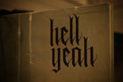 Flat black vinyl decal that reads hell yeah