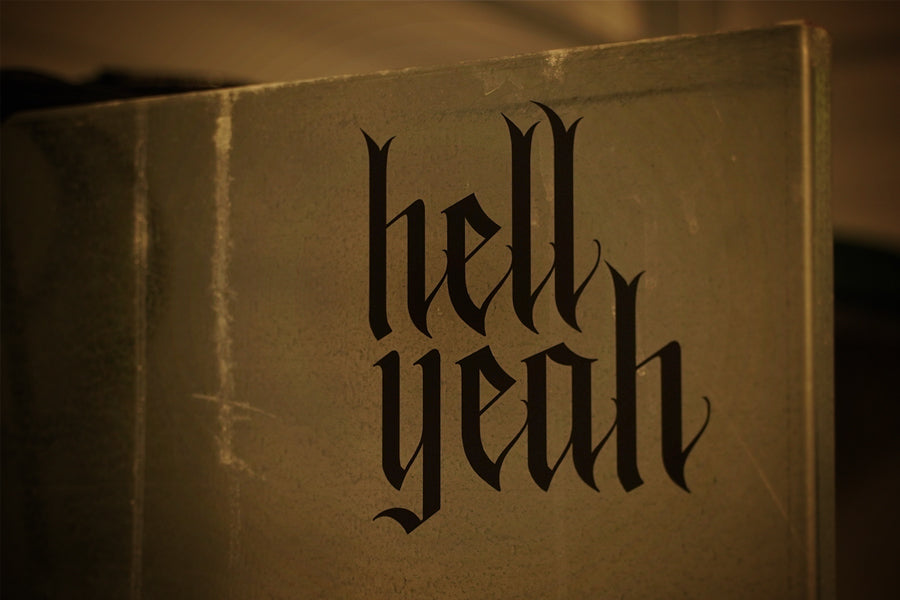 Flat black vinyl decal that reads hell yeah