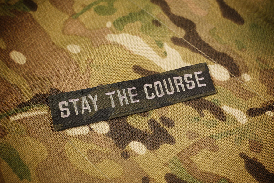 Black camouflage  patch reading 'Stay the Course'