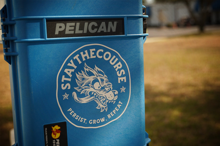 Blue Pelican case with 'Stay The Course' logo decal.