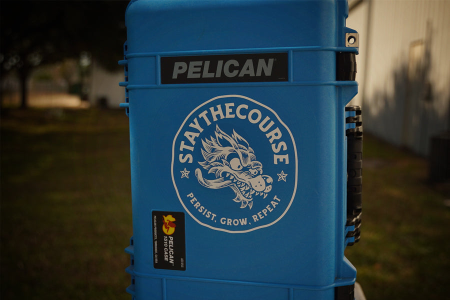 Blue Pelican case with 'Stay the Course' logo, wolf, and "Persist, Grow, Repeat"
.