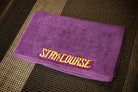 Purple hand towel with yellow embroidered "Stay the Course"